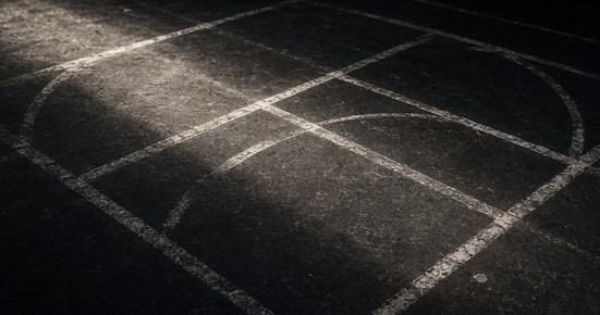 Chalk registration marks on a dark training floor