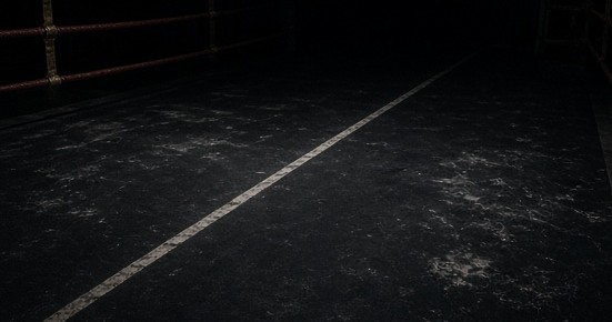 A diagonal path across a clear gym floor